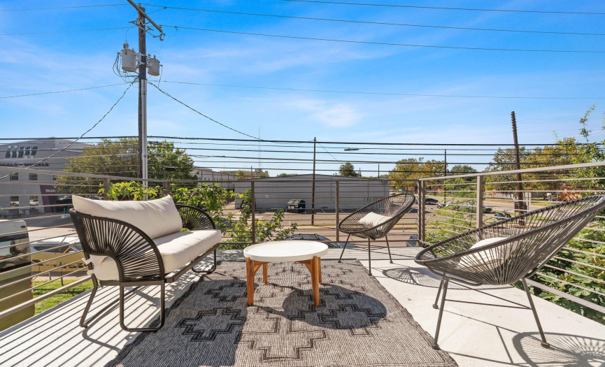 This awesome 2nd-level entertainer's balcony provides space for outdoor living & dining with views of the surrounding community. 