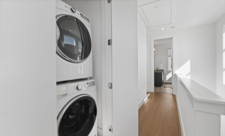 The laundry closet is conveniently located upstairs in between the secondary bedrooms.