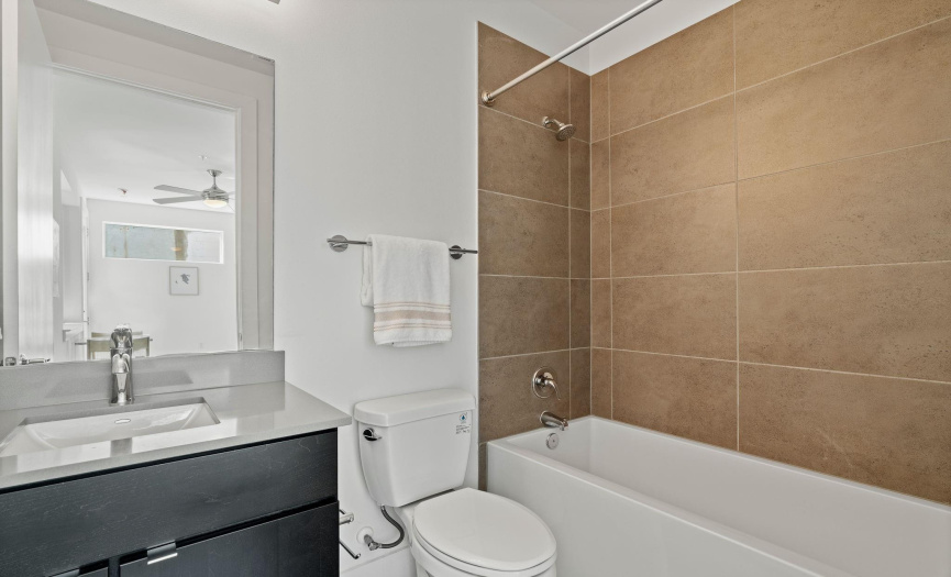 The full ensuite bathroom off the first floor guest suite also comes fully deluxe with tasteful modern finishes.