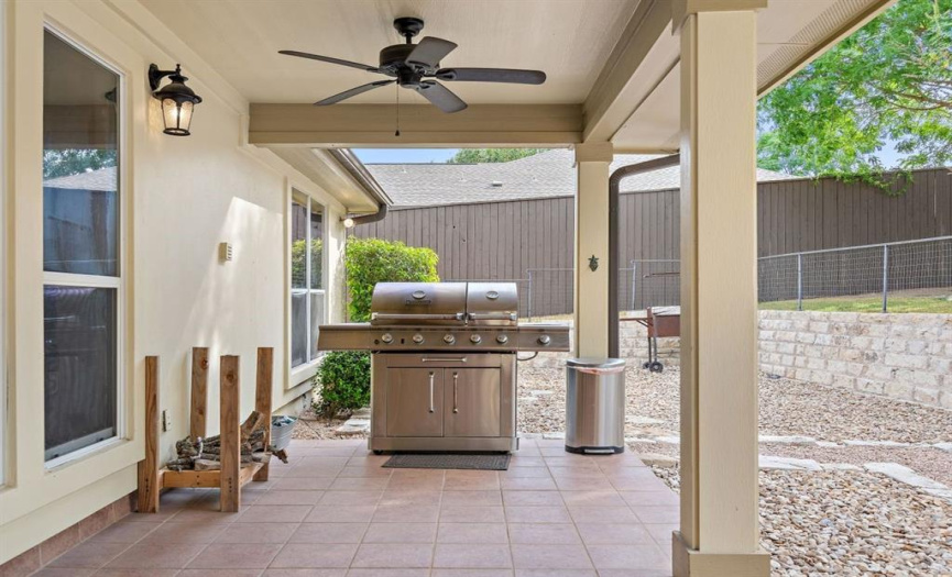 A covered patio provides the ideal space for enjoyable BBQ sessions while staying comfortably shaded.