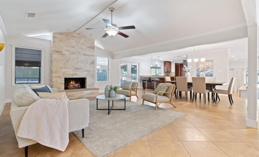 Living, dining room, and kitchen are well connected for entertaining and gathering. 