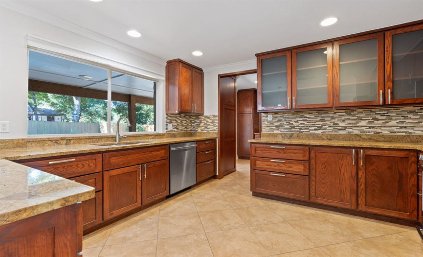 Stainless steel appliances and lots of cabinets with under counter lighting. 