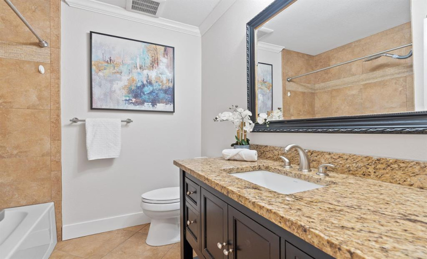 Main floor secondary bathroom, easily accessible from living, kitchen, and office. Enhance guest hospitality and daily living with this strategically located convenience.