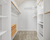 Primary Walk-In Closet with Built-in Shelving