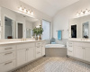 Tons of storage in this primary bath with dual vanities.