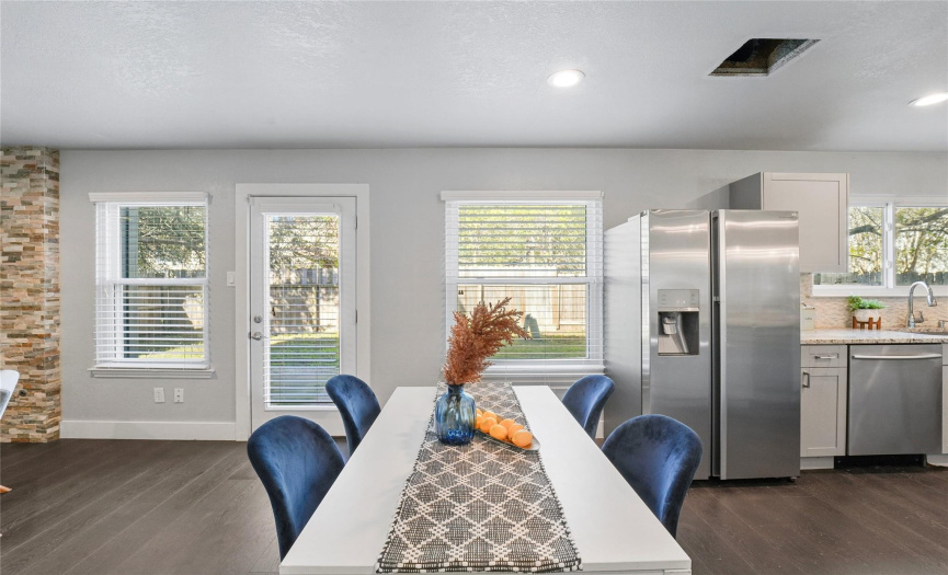 The kitchen offers plenty of space for a breakfast/dining area with this luminous open floor plan. 