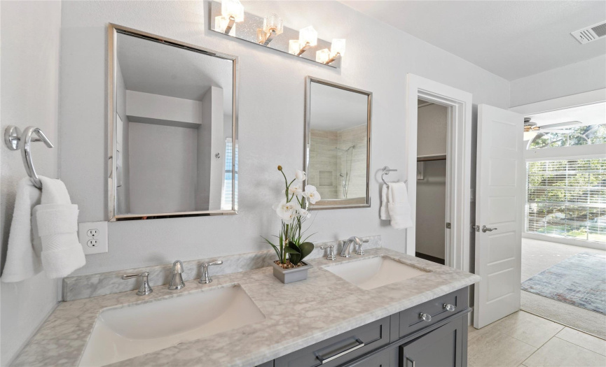 Enjoy your own private ensuite bathroom and walk-in closet! Beautifully updated dual vanity with quartz countertop and Shaker-style cabinetry. 