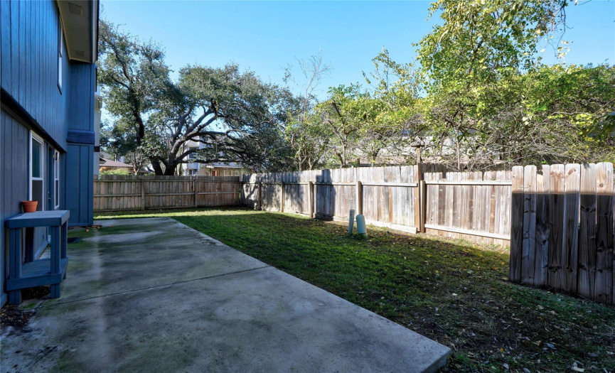 Surrounding shade trees provide excellent privacy. This backyard is a blank slate just waiting for you to come and create your ideal outdoor oasis. 