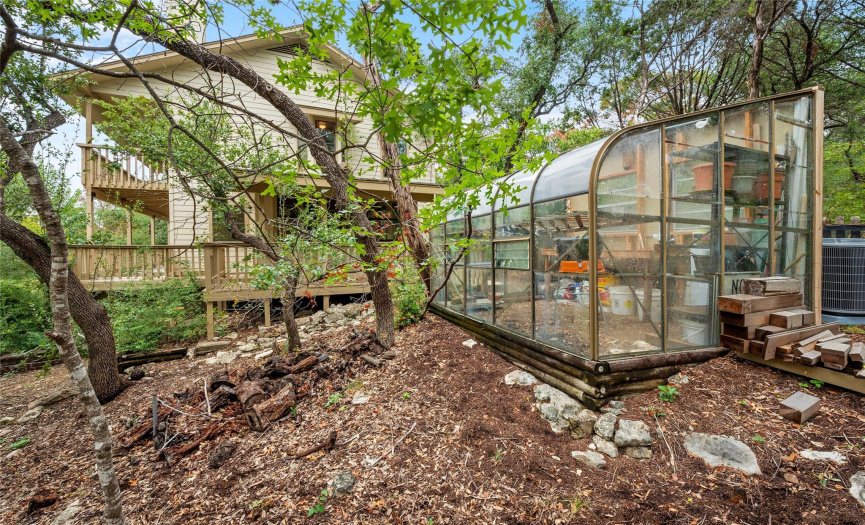 Just off the driveway, bonus room for easy access greenhouse included on the property.