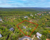 Over 1.25 acres in the Texas Hill Country, Eanes School district and fronting wet weather creek Bruton Springs, paradise ready to go.