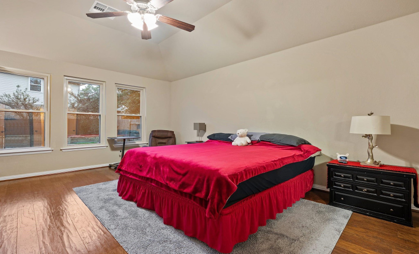 The primary bedroom is strategically located on the main floor for privacy