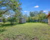 Amazing fenced-in yard surrounded by a variety of shade trees with a storage shed and so much space for you to create your ideal outdoor oasis. 