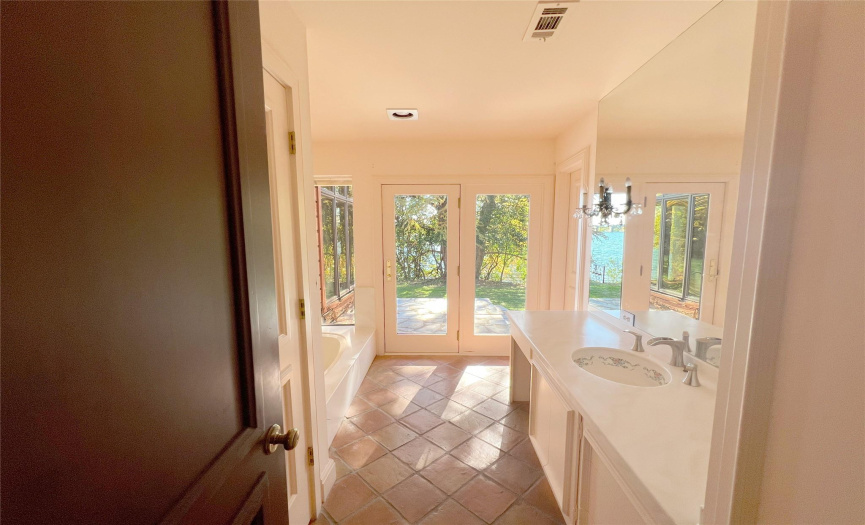 Spare Full Bathroom with lake views and exit!