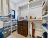 The walk-in closet offers built-in shoe racks and lots of room for all of your clothes and accessories.