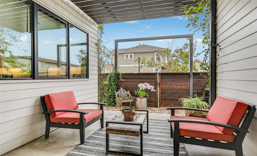 Relax under your covered rear patio that is nestled between the home.