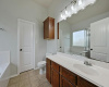 Primary ensuite bathroom with garden tub, separate shower and walk-in closet.