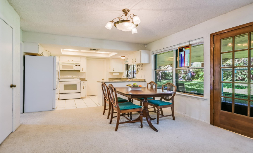 Informal dining between the kitchen and family room -- all overlooking the incredible backyard.