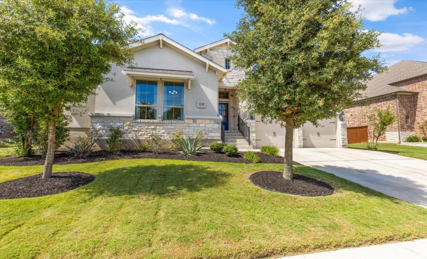 Stucco and Stone give this home elegance and grace! Large trees and no front neighbors!! 
