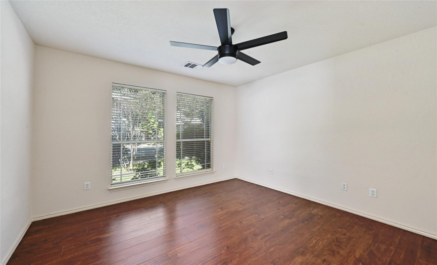 Office/ Bonus Room with updated ceiling fan and view of front yard