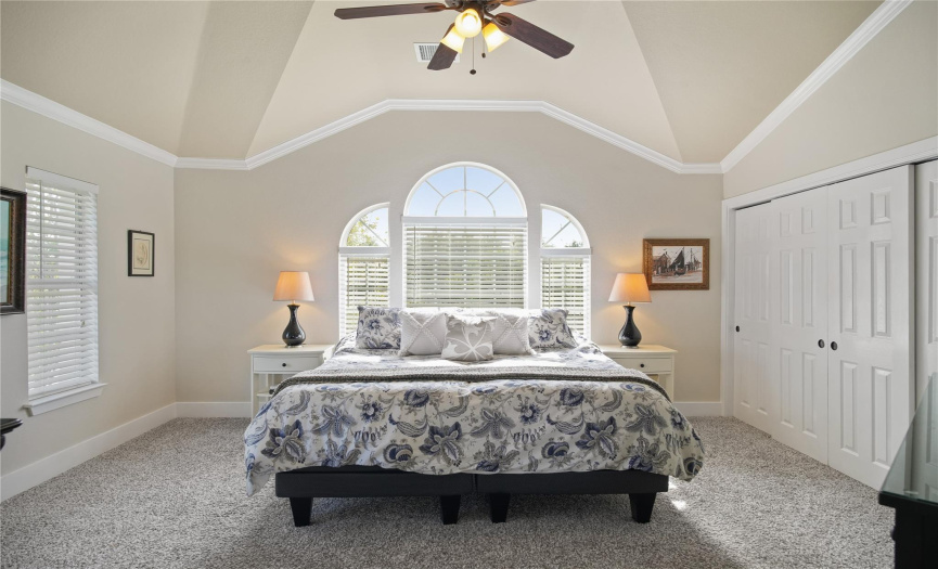 The primary suite, upstairs, has vaulted ceilings, crown molding, two closets and en-suite bathroom.