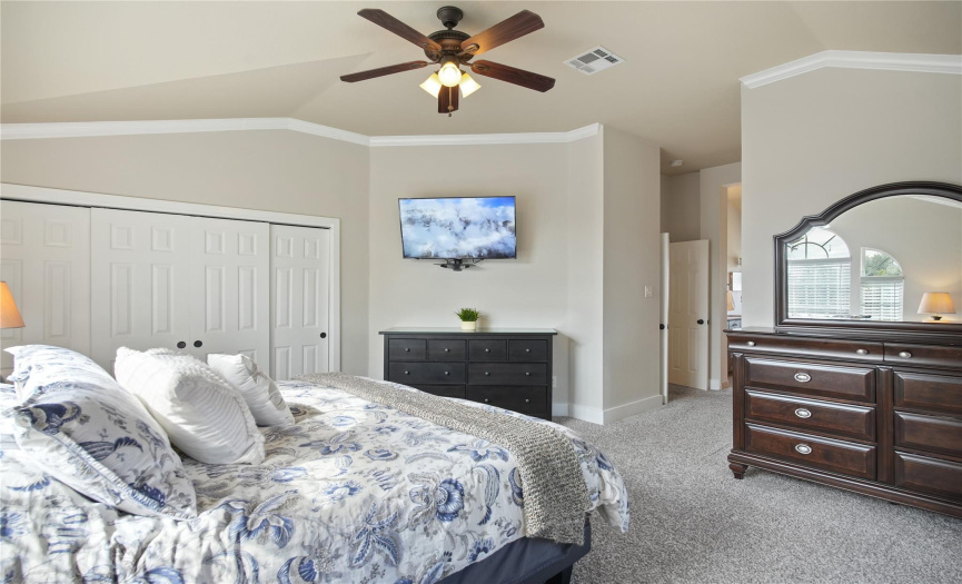 The primary suite, upstairs, has vaulted ceilings, crown molding, two closets and en-suite bathroom.