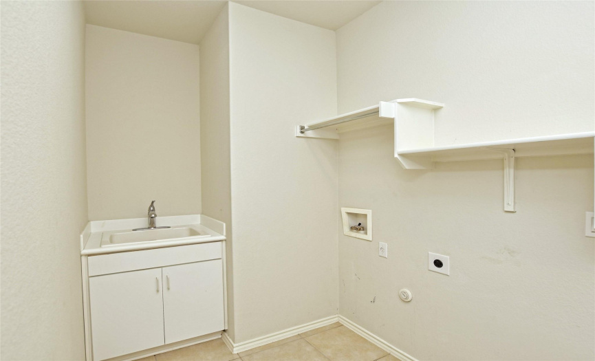 Laundry room with utility sink.