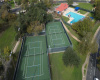 Overhead Shot of one of the Pools and Tennis Court Areas