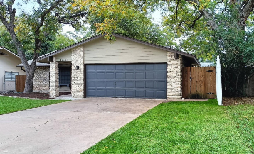 Deep Flat Driveway affords Easy Off Street Parking for yourself or Guests in Addition to Spacious 2-Car Garage