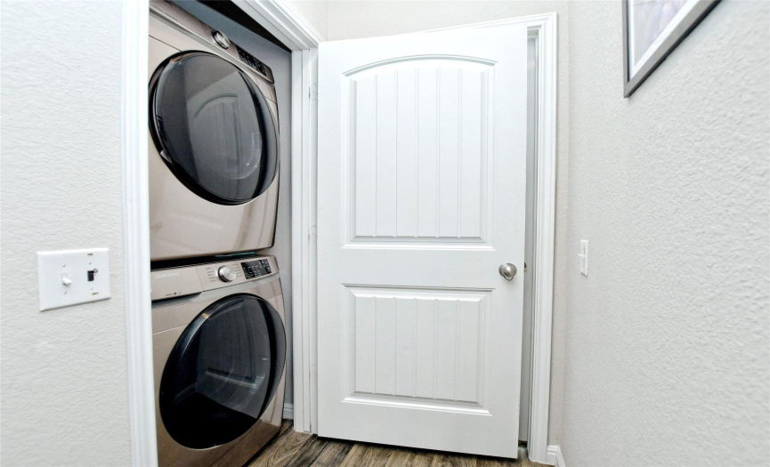Laundry closet for stacked washer and dryer.