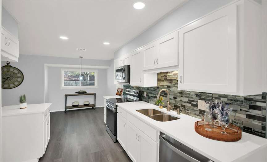 Beautifully updated kitchen with quartz counters and stainless appliances!