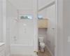 Jetted main tub/shower and water closet.