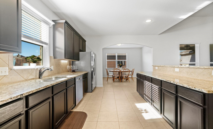 The kitchen is well-equipped with sleek stainless-steel appliances, creating a culinary haven for the home chef.