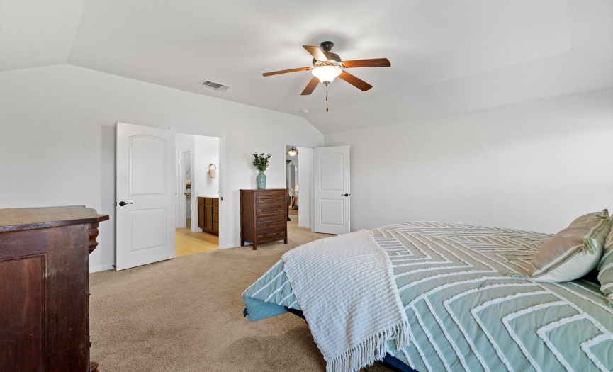 The primary bedroom offers wonderful privacy along with a spacious walk-in closet for added convenience.