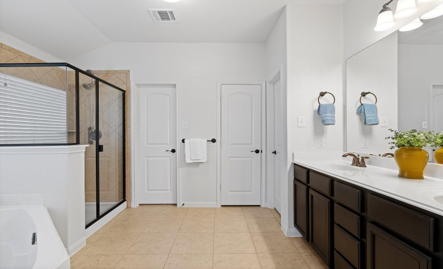 Indulge in luxury in the primary bathroom, where you can enjoy the convenience of a spacious double vanity.