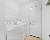 The laundry room is connected to the garage, featuring built-in shelving making daily chores a breeze.