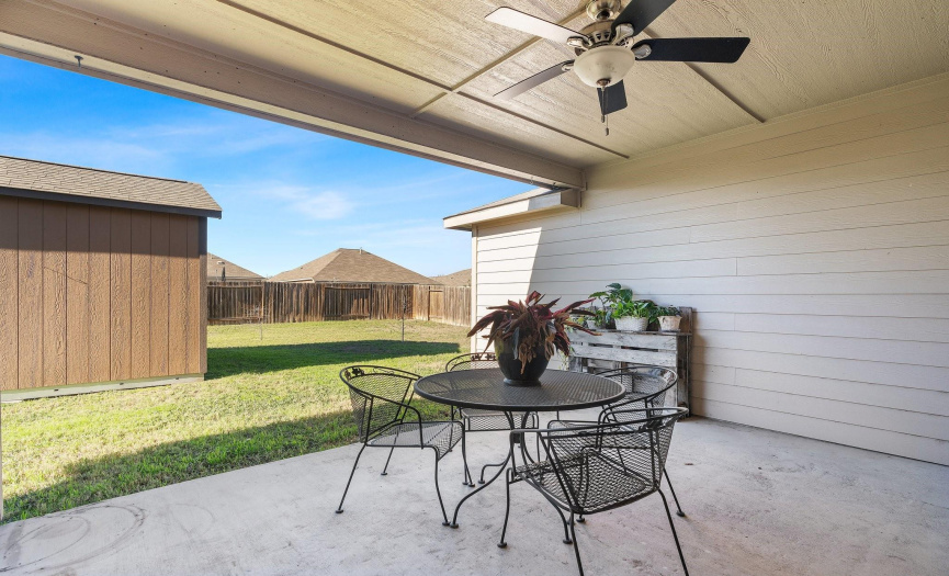 Step outside to the covered patio, offering a perfect spot for outdoor enjoyment, whether it's a morning coffee or an evening gathering with friends and family.
