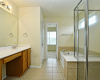 The primary bathroom has double vanity, separate shower and garden tub