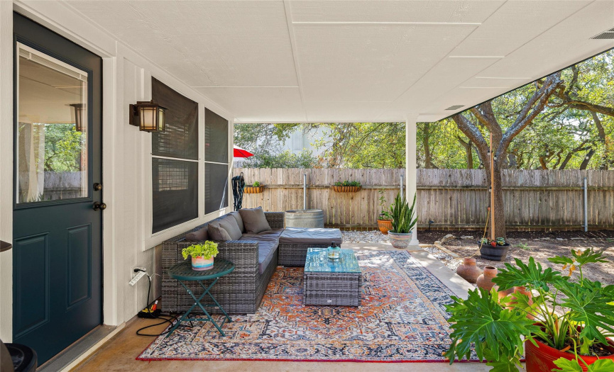 Tastefully decorated, this porch invites you drink a cup of coffee in the morning.
