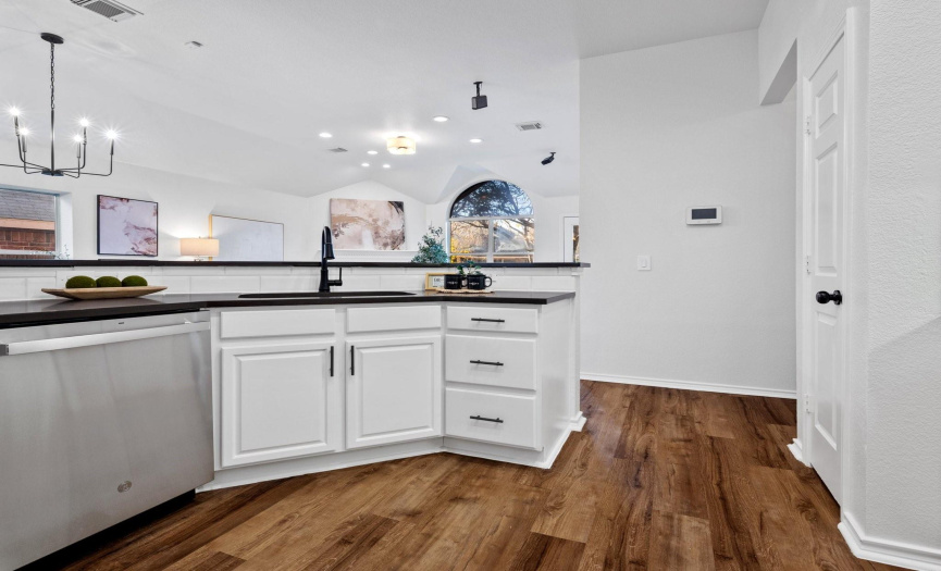 The kitchen, strategically designed to overlook the living room, transforms cooking into a social experience. Stay connected, entertain, and savor the joy of creating delicious moments in this stylish and open culinary haven