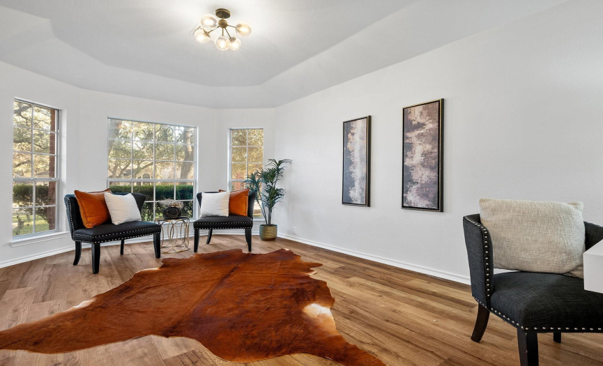 As you step inside this recently remodeled gem, you're greeted by recently installed luxury vinyl plank flooring and freshly painted white walls, ceilings, doors, and trim