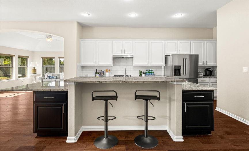 Updated kitchen including granite counters, and tile backsplash