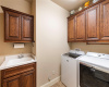 large laundry room with a sink on main level of the home