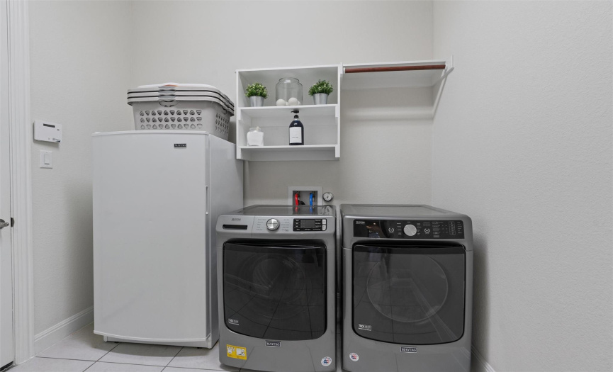 Laundry room with space! Freezer is excluded.