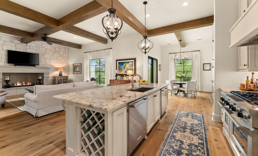 Chef's dream kitchen, high-end appliances, 3 ovens, open floor plan to family living space. Custom glazed cabinetry, butler's pantry, wine rack, double dishwashers