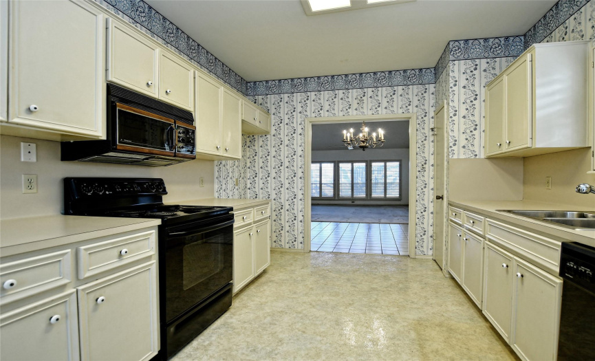 Vintage charm in this country kitchen open to the formal dining area & living room. 