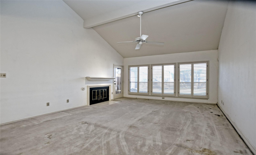 Living Room with wall of windows and fireplace