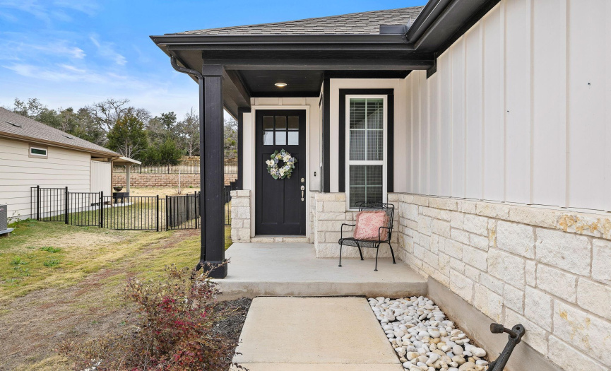 Lovely front porch welcomes you as you walk up to this beautiful property.
