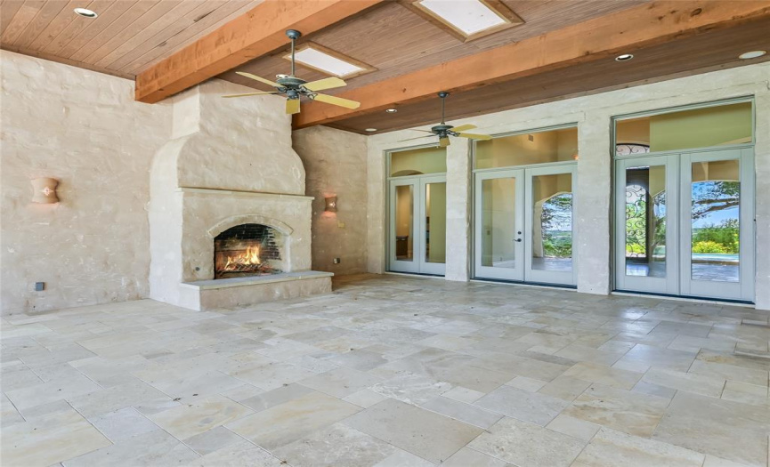 Covered outdoor living with Texas size fireplace