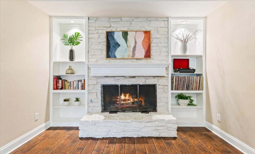 Nestled in the heart of the living space, the gas starter fireplace exudes warmth.