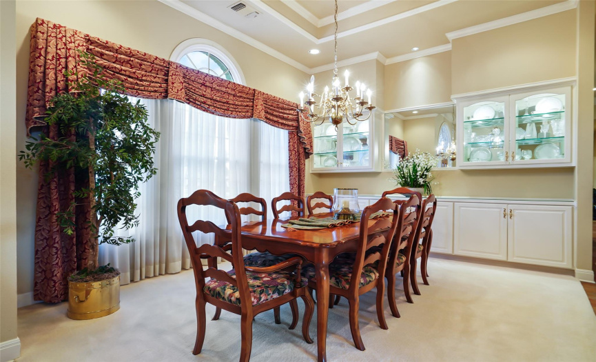 Large dining area with glass built-ins to display your most cherished pieces